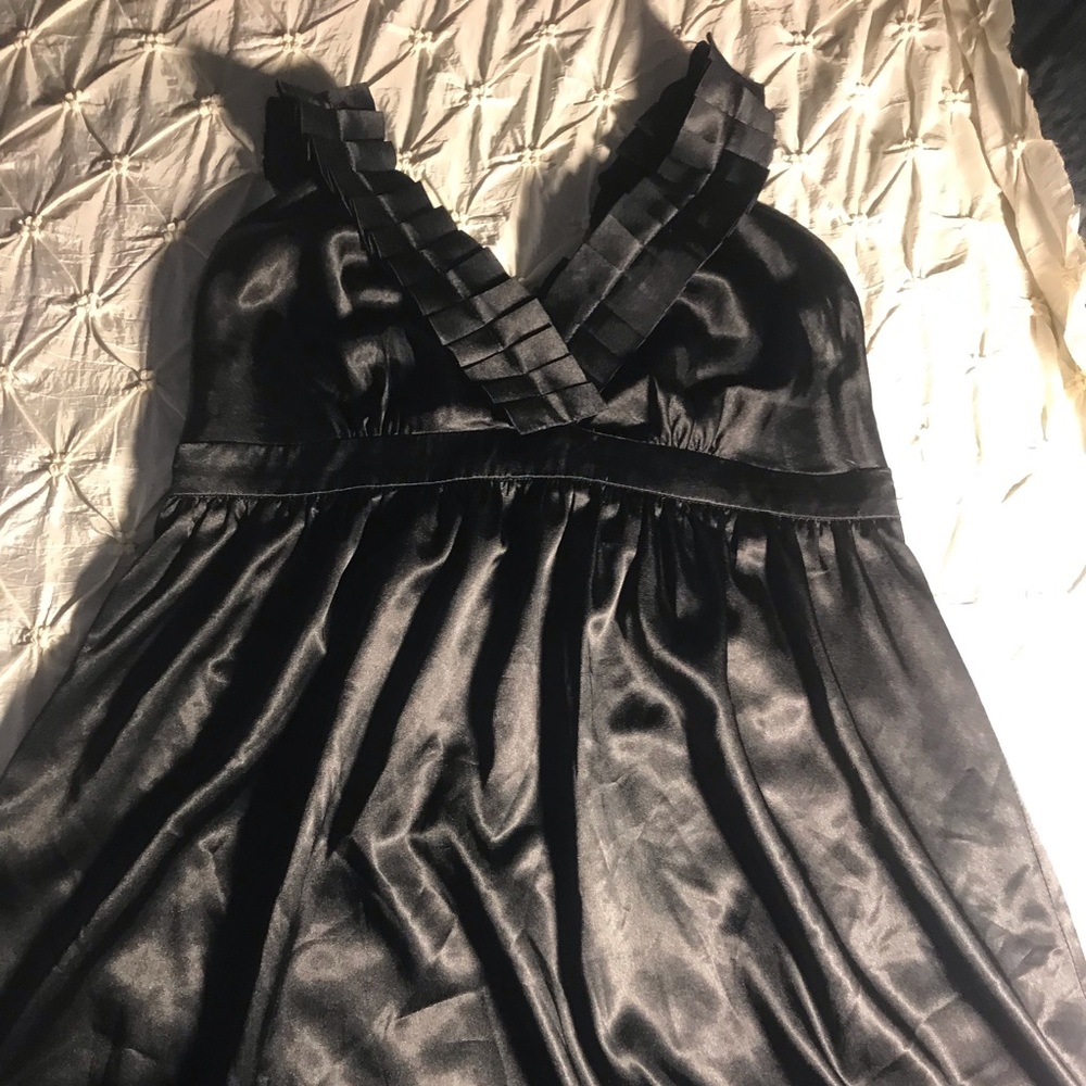 Duo Black cross sleeve shiny top